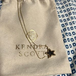 Black kendra scott star with gold chain and adjustable length/clip